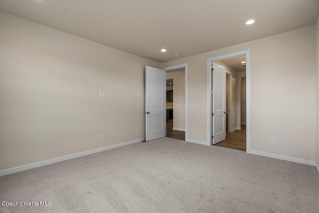 unfurnished bedroom with recessed lighting, baseboards, and carpet floors