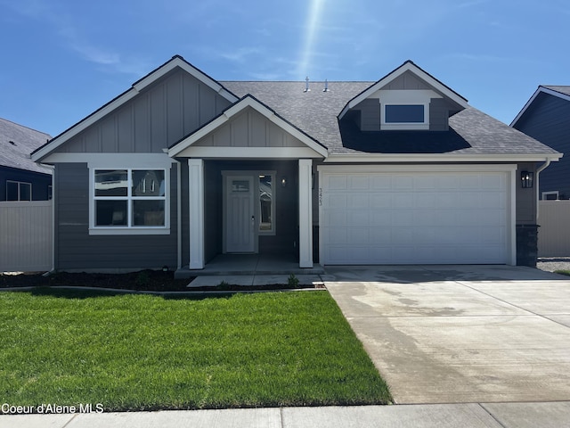 3423 N Cyprus Fox Loop, Post Falls, ID 83854 - single story home with a shingled roof, board and batten siding, driveway, and an attached garage