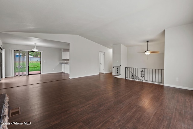 unfurnished living room with ceiling fan, baseboards, lofted ceiling, and wood finished floors