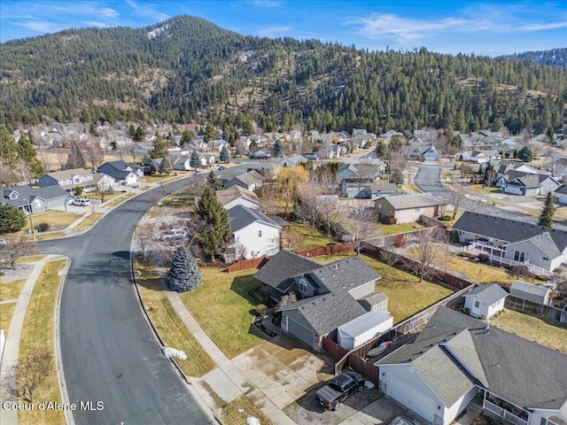 aerial view with a wooded view and a residential view