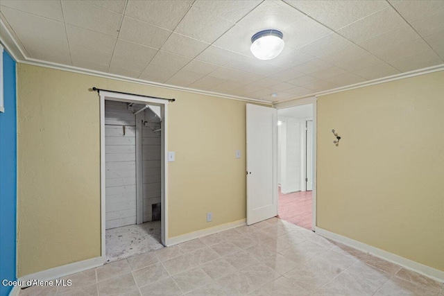 unfurnished bedroom featuring baseboards and ornamental molding