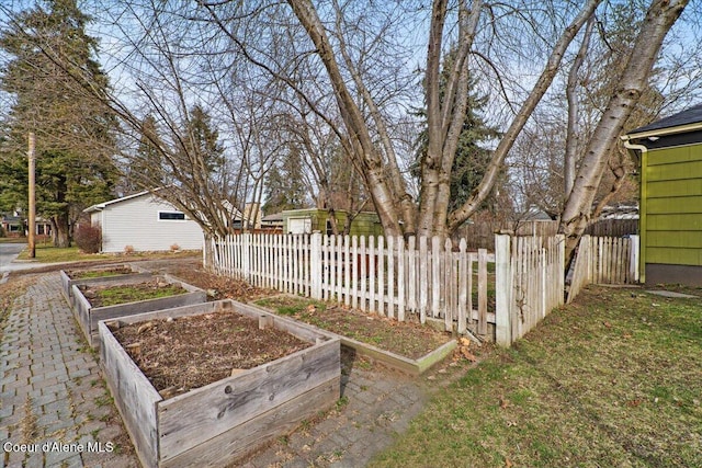 view of yard with a garden and a fenced front yard