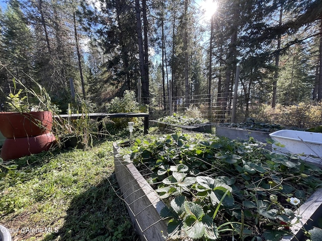 view of yard featuring a garden and fence