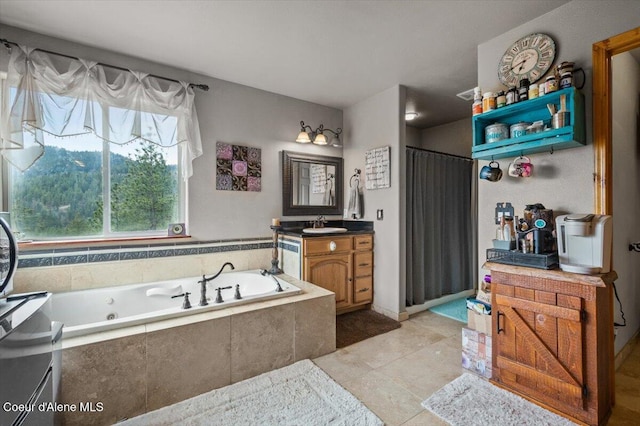 bathroom featuring tile patterned floors, a jetted tub, vanity, and a shower with shower curtain