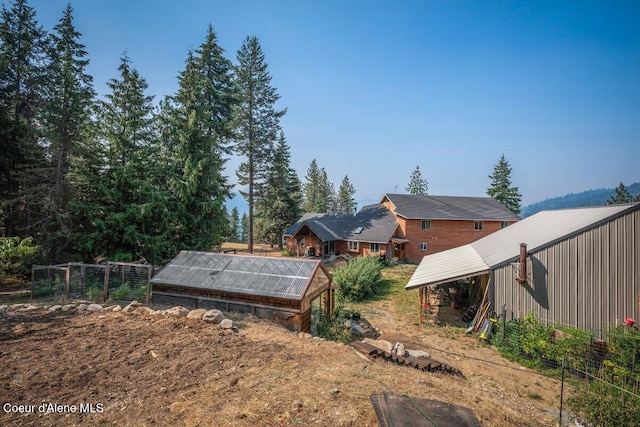 view of yard featuring an exterior structure and an outdoor structure