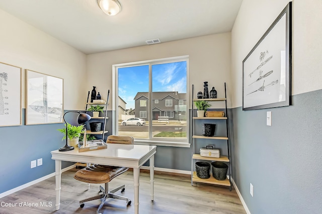 355 E Burdock Loop, Hayden, ID 83835 - home office featuring visible vents, baseboards, and wood finished floors