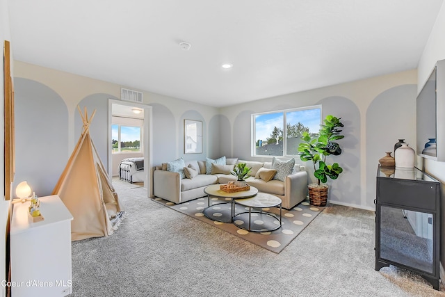 355 E Burdock Loop, Hayden, ID 83835 - living room with carpet, visible vents, and a healthy amount of sunlight
