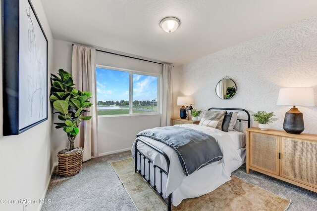 355 E Burdock Loop, Hayden, ID 83835 - bedroom with baseboards and light colored carpet