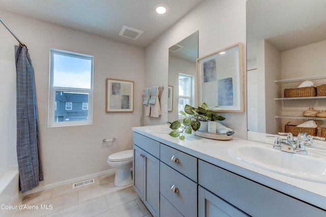 355 E Burdock Loop, Hayden, ID 83835 - bathroom featuring a sink, toilet, a wealth of natural light, and tile patterned floors