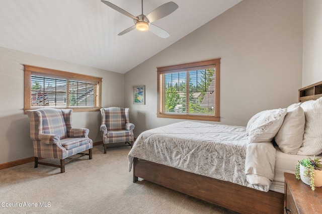 bedroom with baseboards, multiple windows, light colored carpet, and lofted ceiling