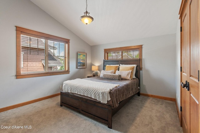 bedroom featuring vaulted ceiling, multiple windows, carpet, and baseboards