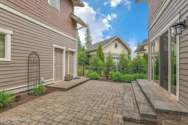 view of patio featuring fence