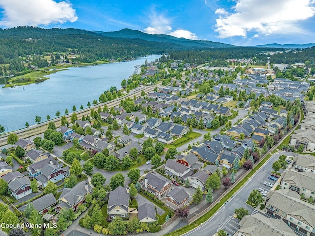 birds eye view of property featuring a residential view and a water and mountain view