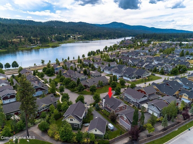 bird's eye view with a residential view and a water and mountain view