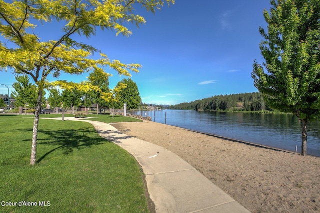 view of home's community featuring a yard and a water view