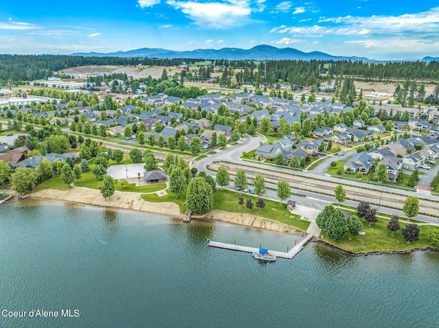 birds eye view of property featuring a residential view and a water and mountain view