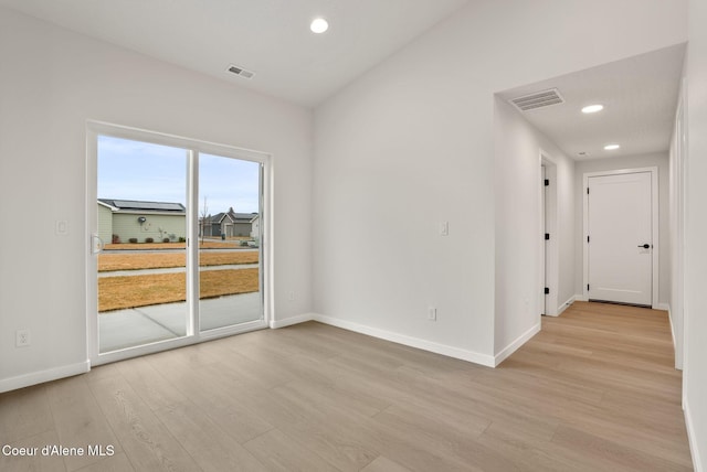 unfurnished room with recessed lighting, visible vents, baseboards, and light wood finished floors