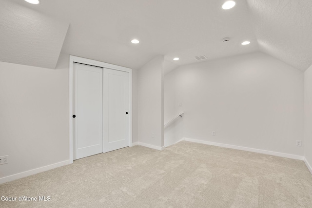 bonus room with visible vents, baseboards, lofted ceiling, carpet floors, and recessed lighting