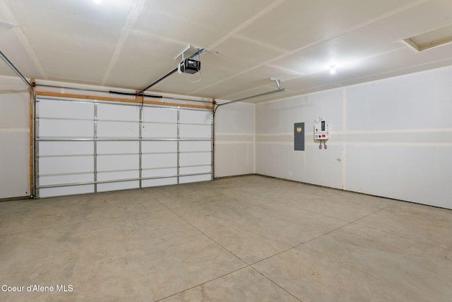 garage with electric panel and a garage door opener