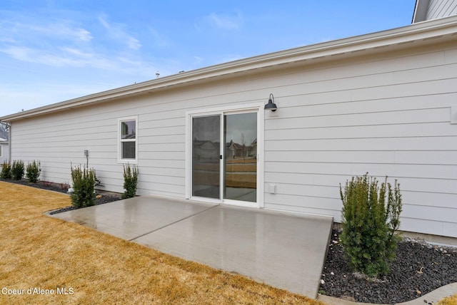 rear view of property featuring a yard and a patio area