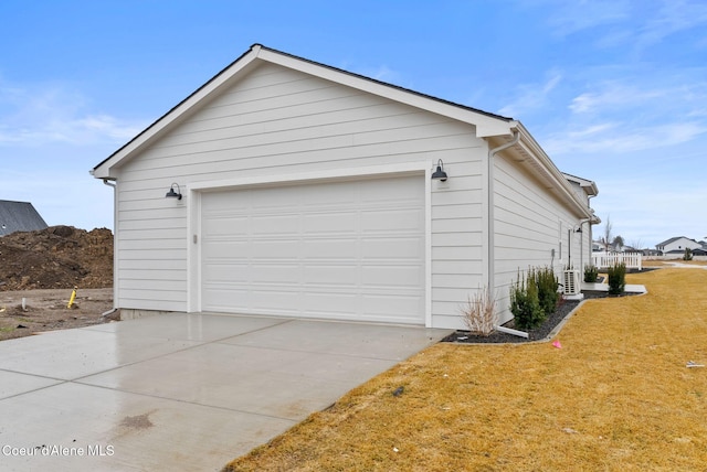 garage with concrete driveway