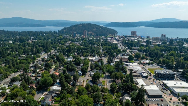 aerial view featuring a water and mountain view