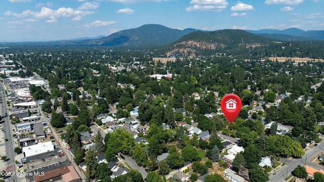 birds eye view of property with a mountain view