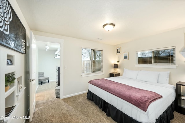 bedroom featuring visible vents, baseboards, and carpet floors