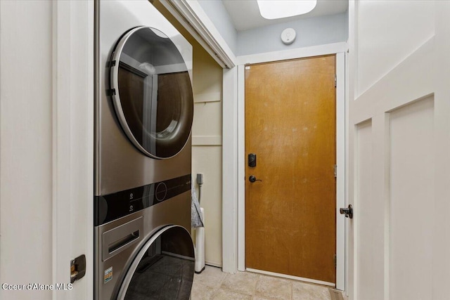 washroom featuring laundry area and stacked washing maching and dryer