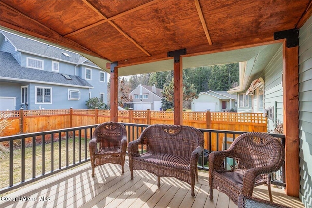 deck featuring a residential view and fence