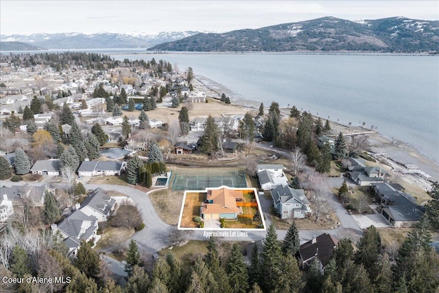 bird's eye view featuring a residential view and a water and mountain view