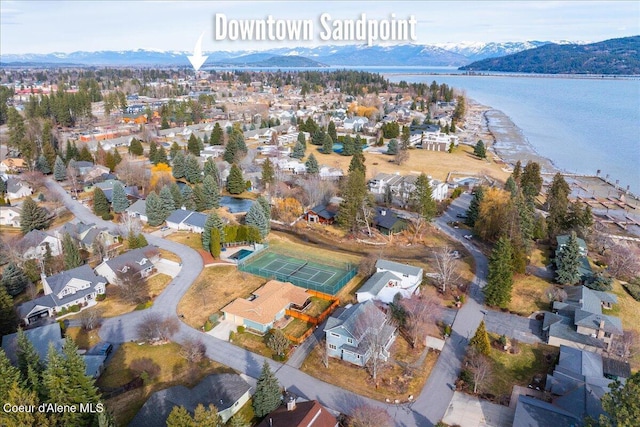 birds eye view of property with a residential view and a water and mountain view