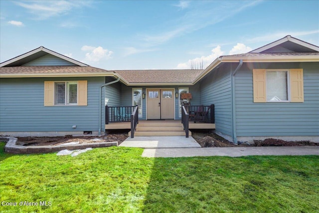 single story home featuring covered porch and a front yard