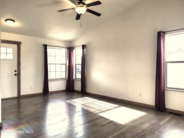 unfurnished room featuring vaulted ceiling, baseboards, ceiling fan, and wood finished floors