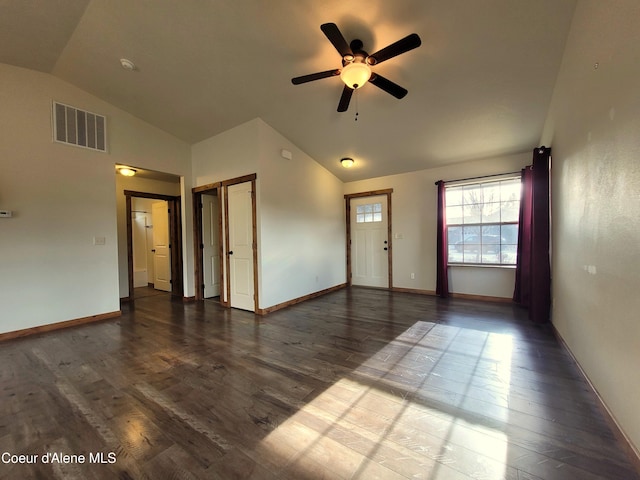 interior space with vaulted ceiling, wood finished floors, a ceiling fan, and visible vents