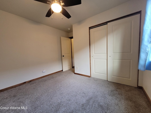 unfurnished bedroom with a ceiling fan, carpet flooring, baseboards, and a closet