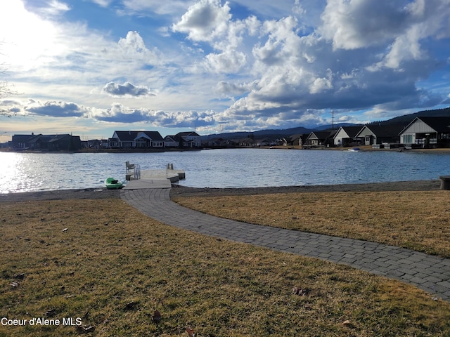 water view with a residential view and a boat dock