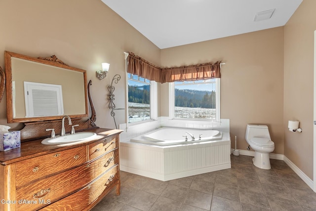 full bath with vanity, visible vents, a garden tub, toilet, and tile patterned floors