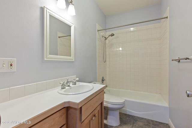 bathroom featuring tile patterned flooring, toilet, vanity, and shower / bathing tub combination