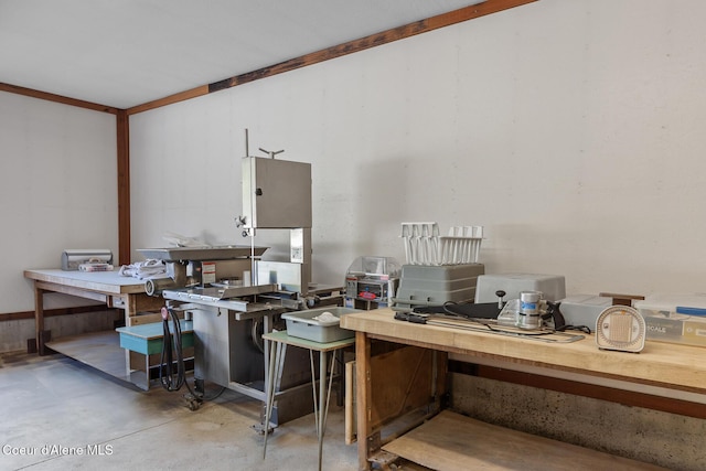 office space featuring a workshop area and concrete flooring