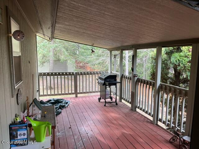 wooden deck featuring grilling area