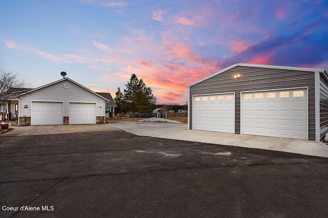 garage at dusk with a garage