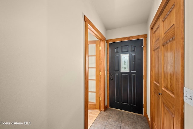 foyer entrance featuring light tile patterned floors