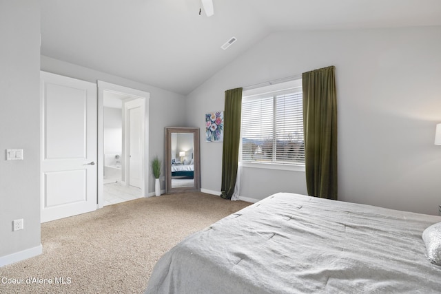 bedroom with carpet, visible vents, baseboards, ensuite bath, and lofted ceiling