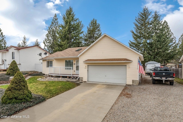 ranch-style home featuring concrete driveway and an attached garage