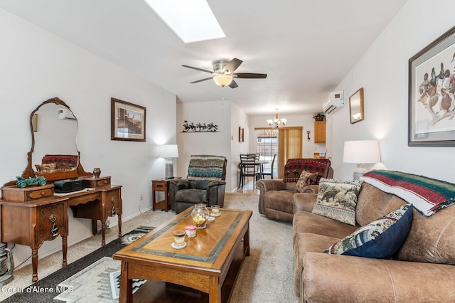 living room featuring ceiling fan with notable chandelier, a skylight, carpet, and a wall unit AC