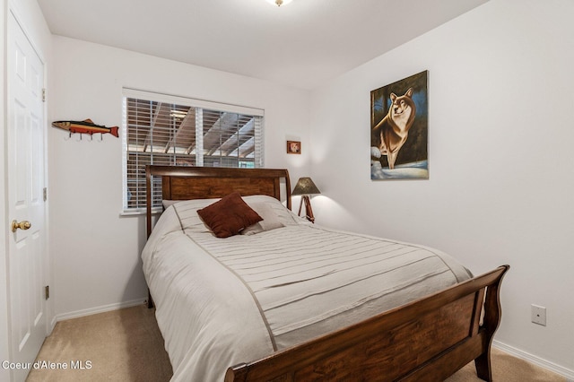 bedroom featuring carpet flooring and baseboards