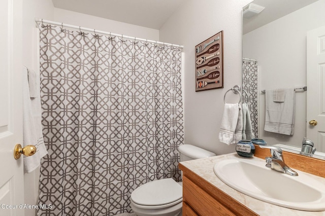 full bathroom with visible vents, toilet, and vanity