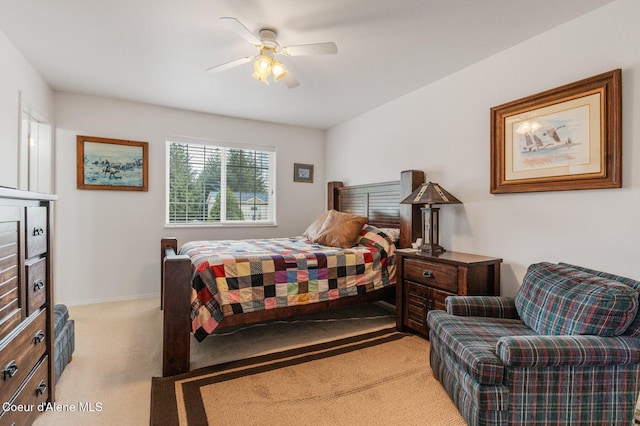 bedroom featuring baseboards, ceiling fan, and carpet flooring