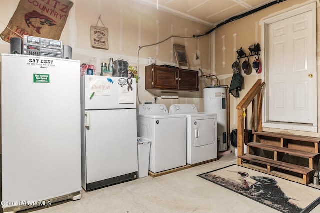 clothes washing area with cabinet space, separate washer and dryer, and electric water heater